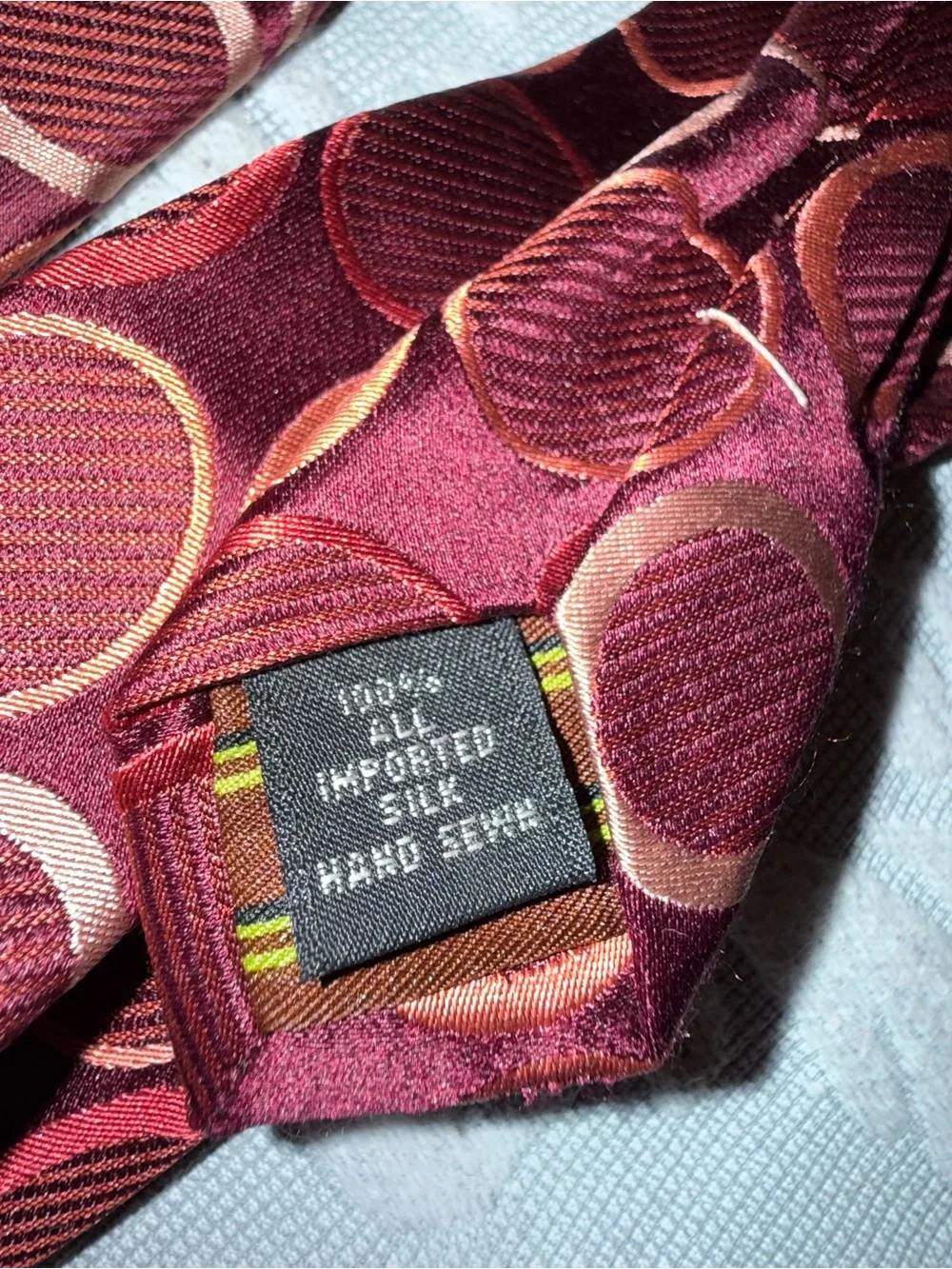 BCBG Burgundy Tie with Copper Circle Pattern